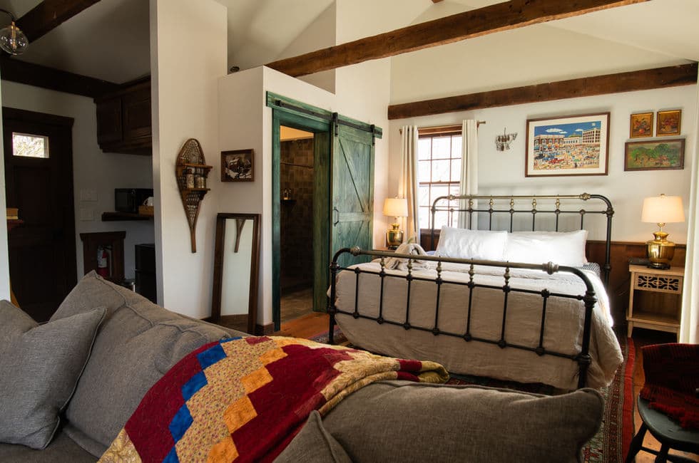 The view of the bedroom seen from the sitting area.